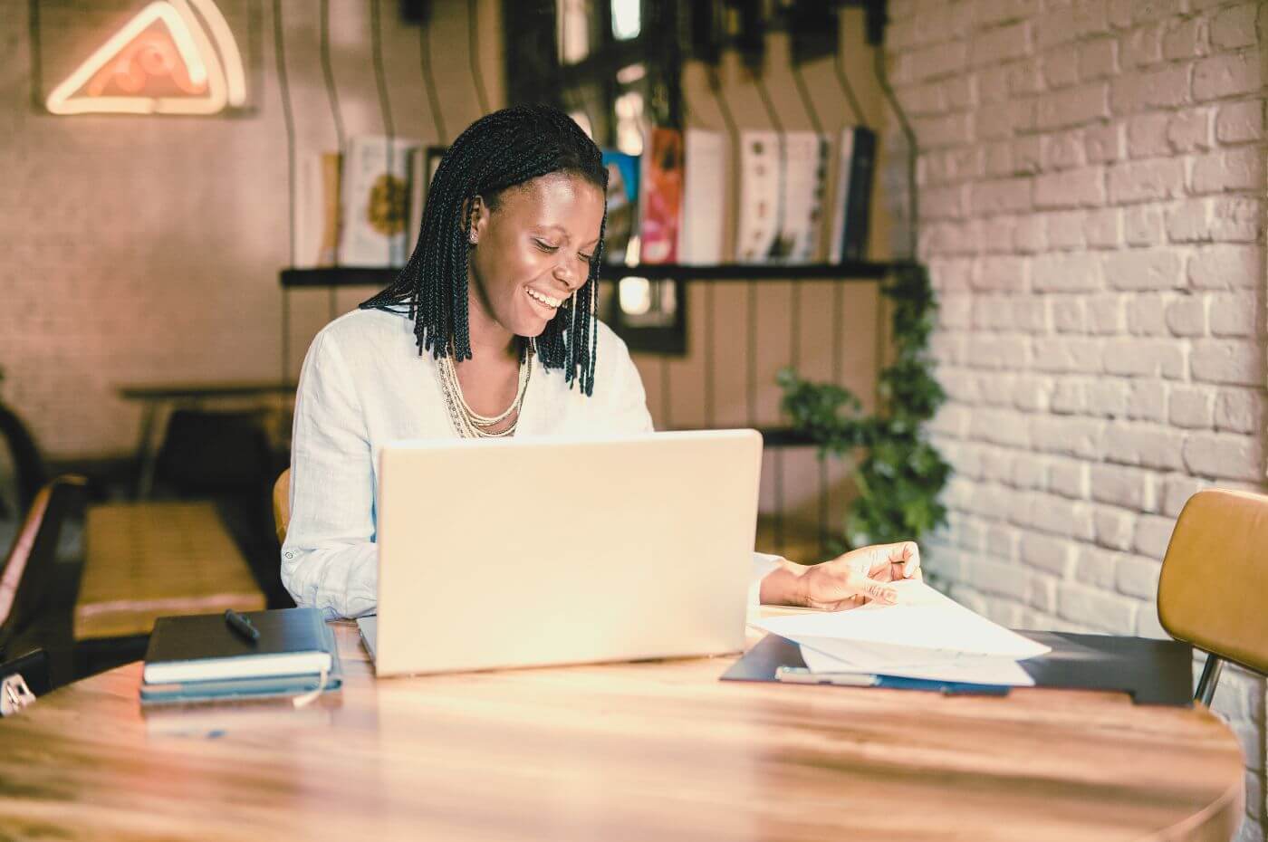 woman creating social media posts for her restaurant