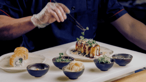 Restaurant chef preparing food behind the scenes to illustrate personality-driven social media content.
