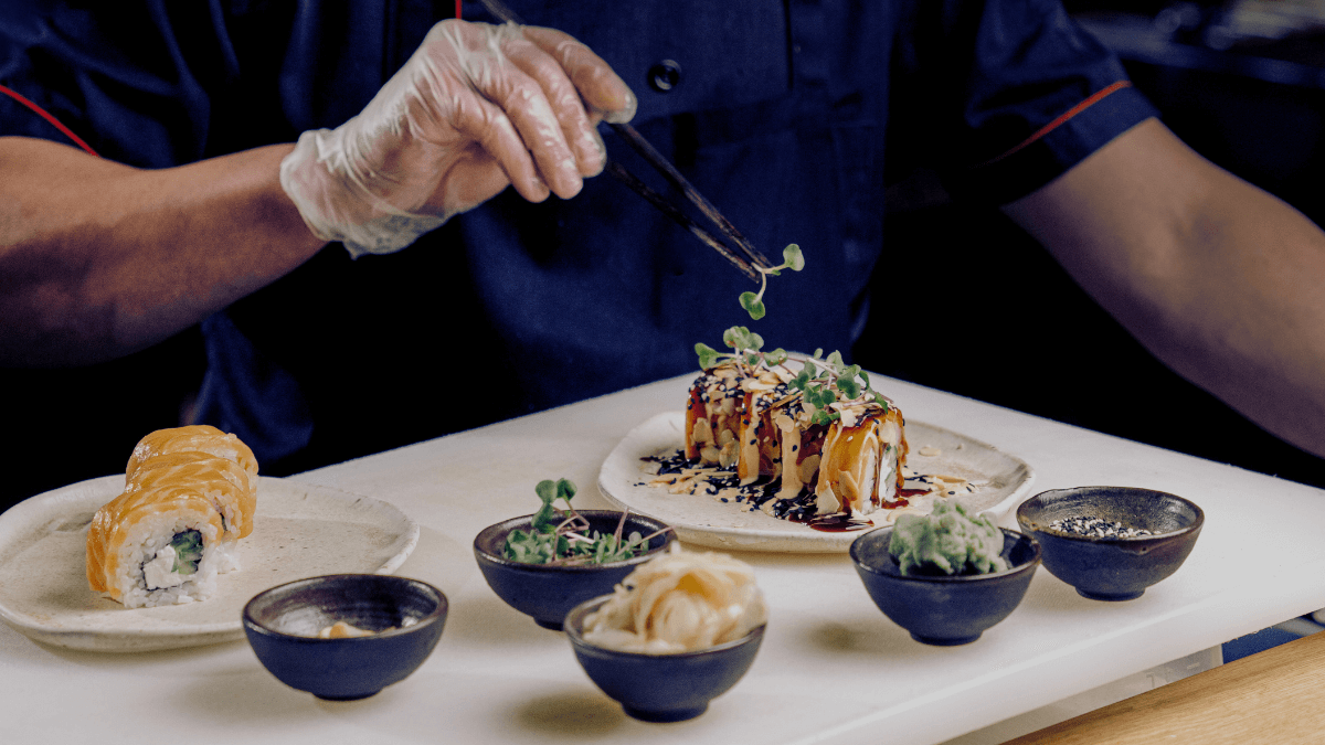 Restaurant chef preparing food behind the scenes to illustrate personality-driven social media content.